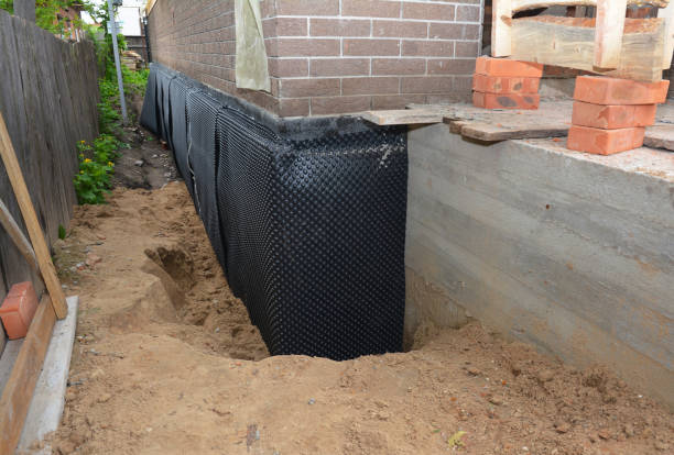Happy homeowners after waterproofing job in Riverdale